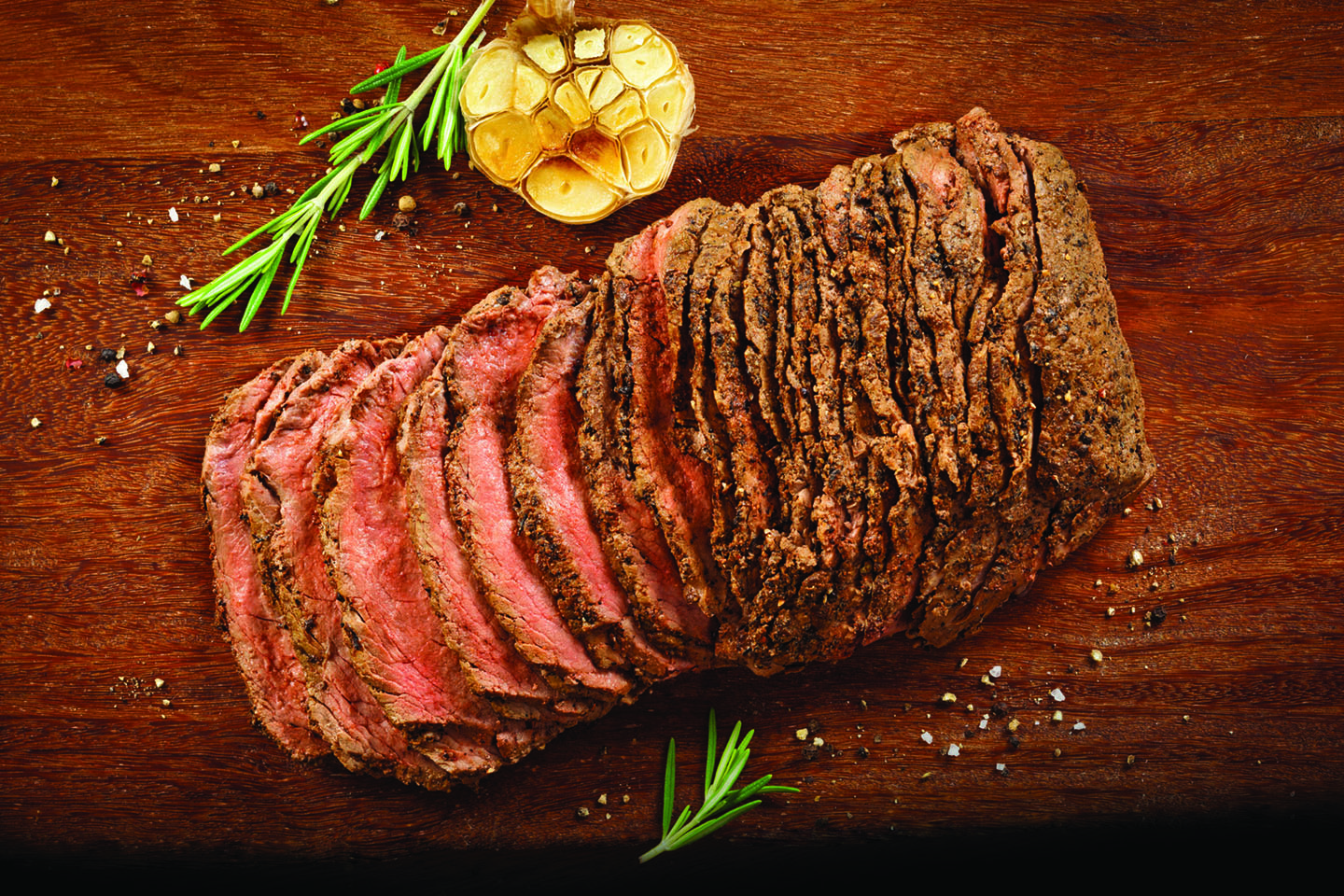 sliced beef on a board