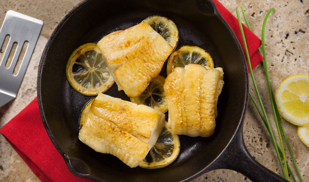 Seared Turbot and lemon slices in cast iron