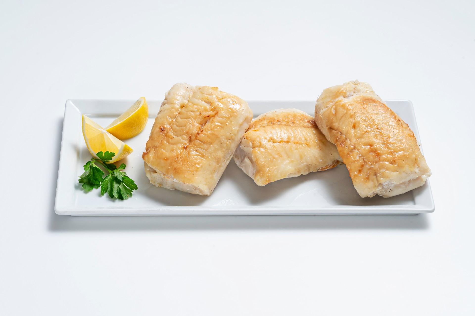 Seared Turbot with lemon on plate