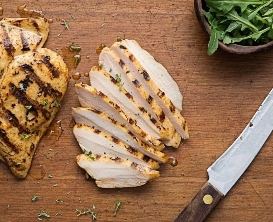 Grilled Sliced Chicken Breast sliced on cutting board