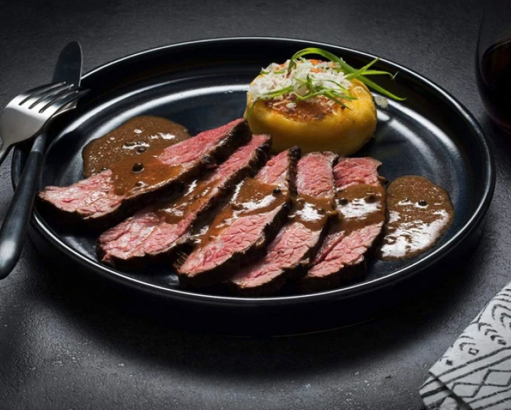 Bone in Beef short rib with sauce on plate