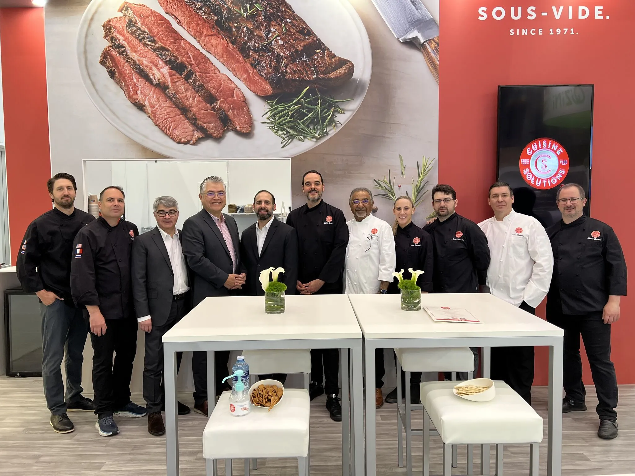 Cuisine Solutions posing in front of their booth at WTCE 2025